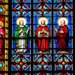 ** Stained glass windows in Cologne Cathedral, vibrant colors, creating an atmosphere of awe and peace.

**